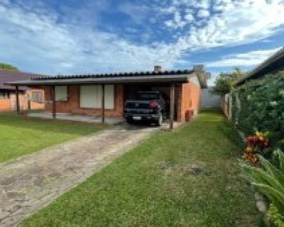 Casa à venda com 131m², 3 dormitórios, 1 suíte, 2 vagas no bairro Centro em Xangri-Lá